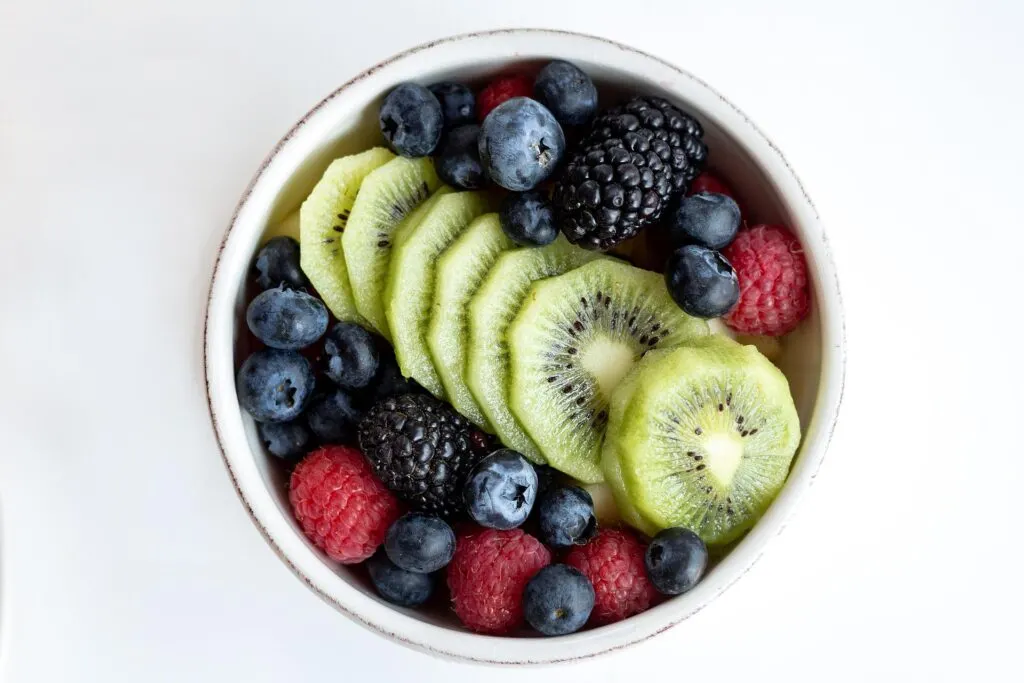 A selection of fruits in a white bowl